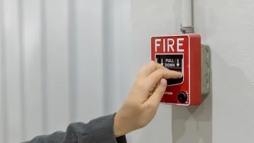 Commercial fire alarm inspection technician testing devices